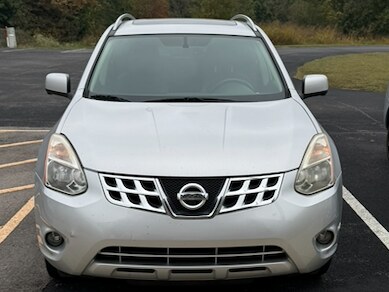 Courtesy car one at Russell County Airport: a silver Nissan Rogue photographed head-on in the airport car park, with a grass verge and treeline behind it